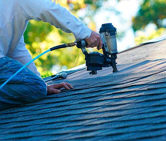 Professional Installing Shingles to Repair Roof