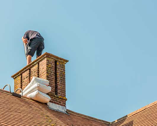 Professional Man Fixing Chimney Liners
