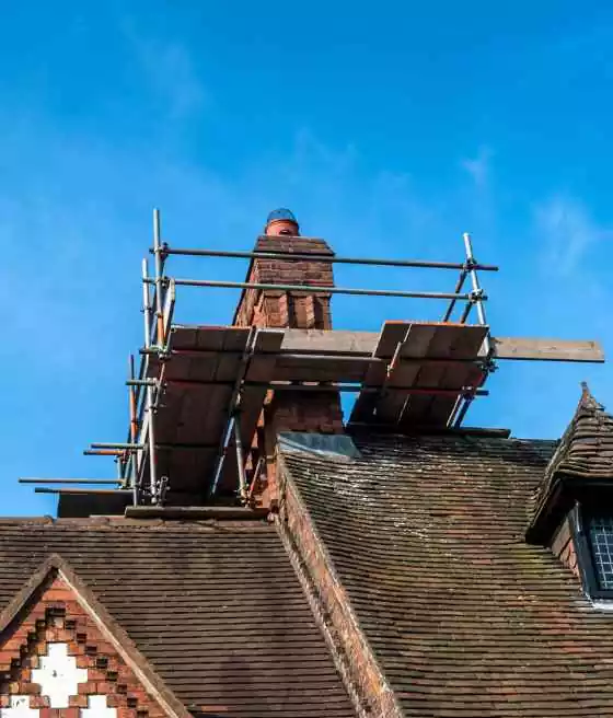 Man Making Masonry for Chimney Repair